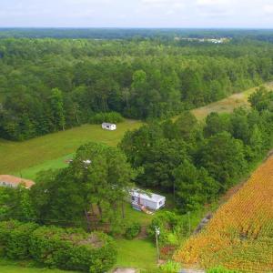 View of rural area with a heavily wooded area