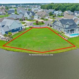 Aerial view of residential area featuring a pool a