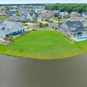 Aerial perspective of suburban area with a pool ar