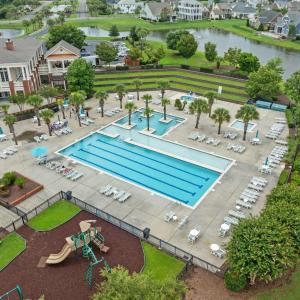 View of swimming pool featuring a water view and a