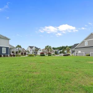 View of grassy yard featuring a residential view