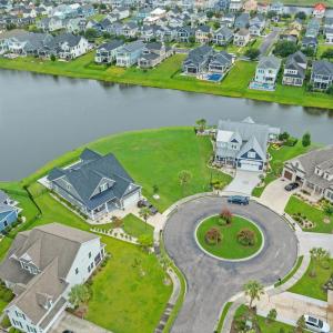 Aerial view of residential area with a nearby body