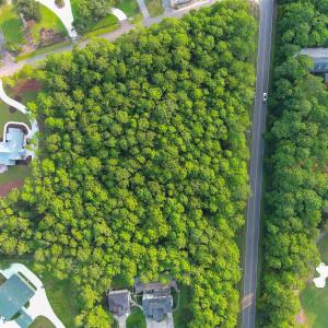 Aerial view of property and surrounding area with