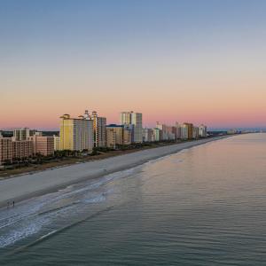 Drone / aerial view of city skyline and unending s