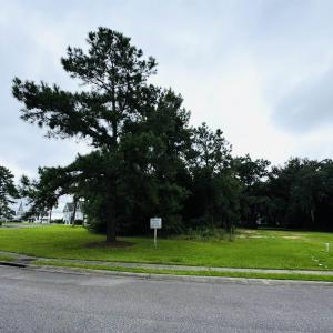 View of asphalt road with sidewalks and curbs