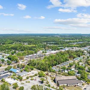 Aerial perspective of suburban area with a forest