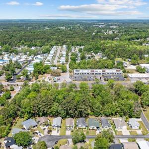 Aerial view of property and surrounding area with