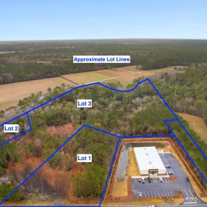 View of property location with a forest and proper