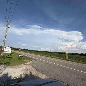 View of asphalt road with a rural view