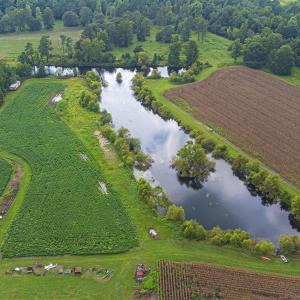 Aerial view of property and surrounding area with