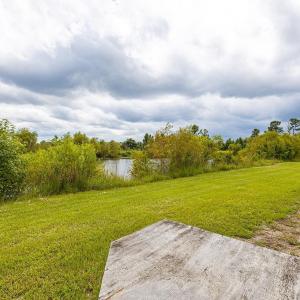 View of grassy yard featuring a water view