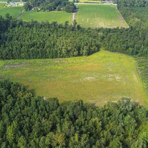 Aerial view of property and surrounding area with