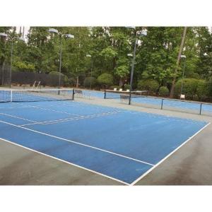 View of tennis court featuring community basketbal