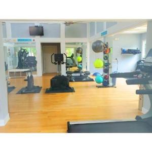 Workout area with wood finished floors and plenty