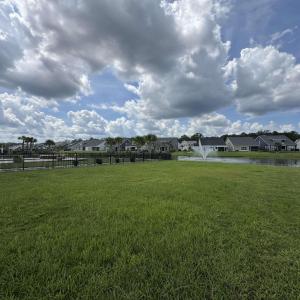 View of grassy yard featuring a residential view a