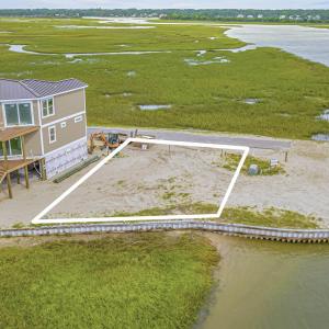 Aerial view of property and surrounding area with