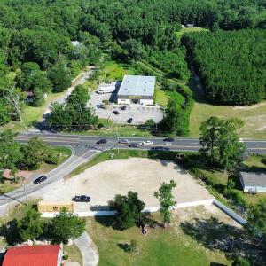 Aerial view of property and surrounding area with