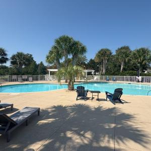 Community pool with a patio