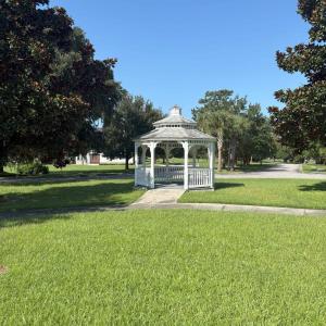 View of property's community featuring a yard, a g