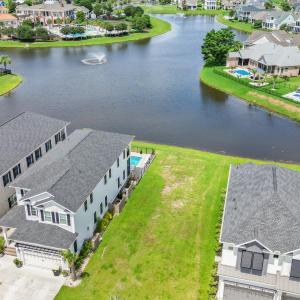 Aerial view of residential area with a nearby body