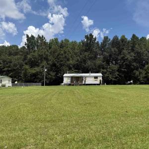 View of yard featuring a wooded view