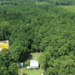Aerial view of property and surrounding area with