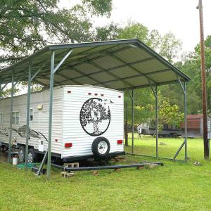 View of vehicle parking featuring a carport and vi