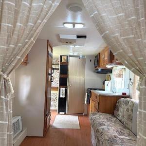 Kitchen featuring wood finished floors, brown cabi