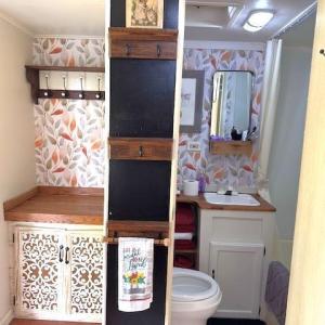 Bathroom featuring vanity and crown molding