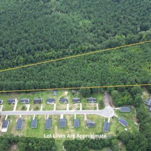 Aerial view of property and surrounding area with