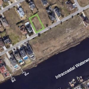 Aerial map of property and surrounding area with p