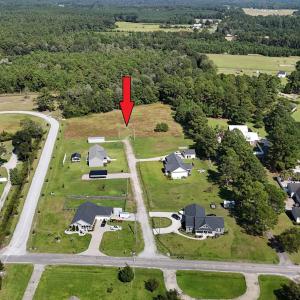 View of property location featuring a forest and n