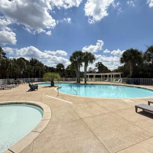Community pool featuring a patio area