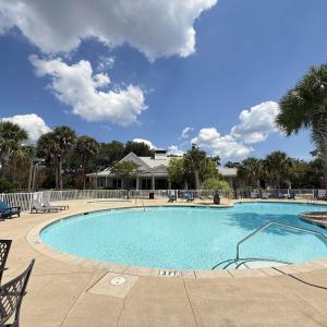 Community pool featuring a patio area