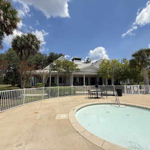 Community pool featuring a patio