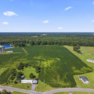 Aerial view of property and surrounding area with