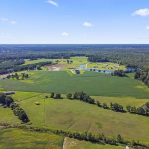 Aerial view of a nearby body of water and a heavil