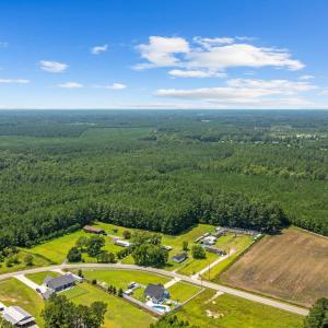 Aerial view of property and surrounding area with