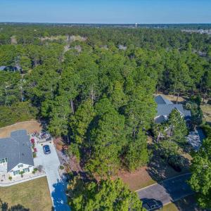 Aerial view of property and surrounding area with