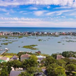 Aerial perspective of suburban area with a nearby