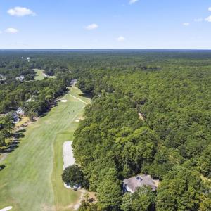 Aerial view of property and surrounding area with