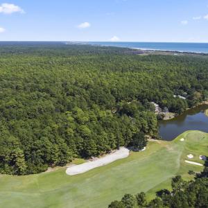 Aerial view of property and surrounding area with