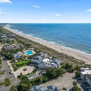 Aerial view of unending shoreline and a pool