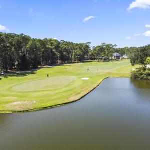 Surrounding community with view of golf course, vi