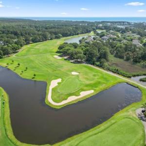 Drone / aerial view of a nearby body of water and