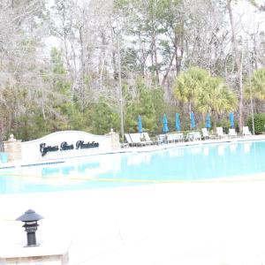 Community pool featuring a patio