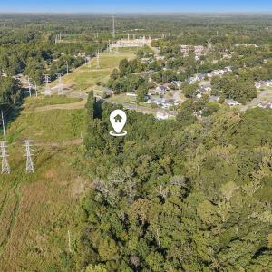 Aerial view of property and surrounding area featu