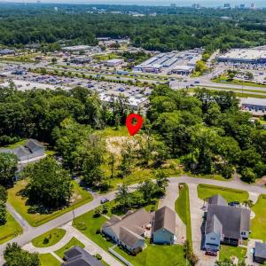 Aerial perspective of suburban area with a tree fi
