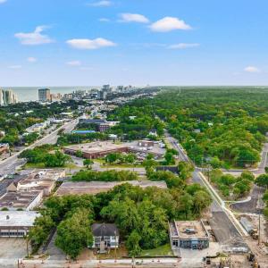 View of property location with nearby urban area