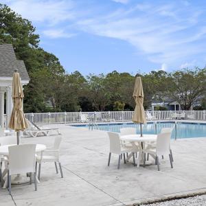 Community pool featuring a patio